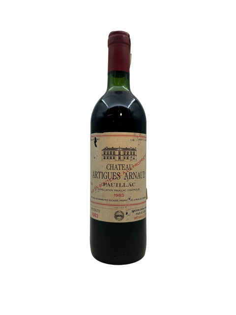 Bottle of Château Artigues Arnaud 1983 red wine with classic label