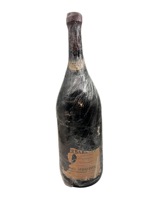 Bottle of Barbaresco Rosso Sebastian 1971 red wine wrapped in plastic